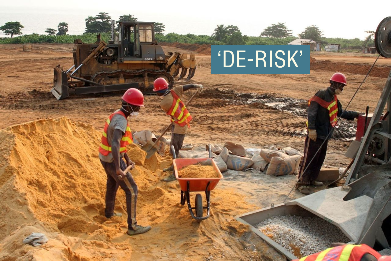 Labourers mix cement at the site of a new port to be built in the oil-producing Angolan exclave of Cabinda.