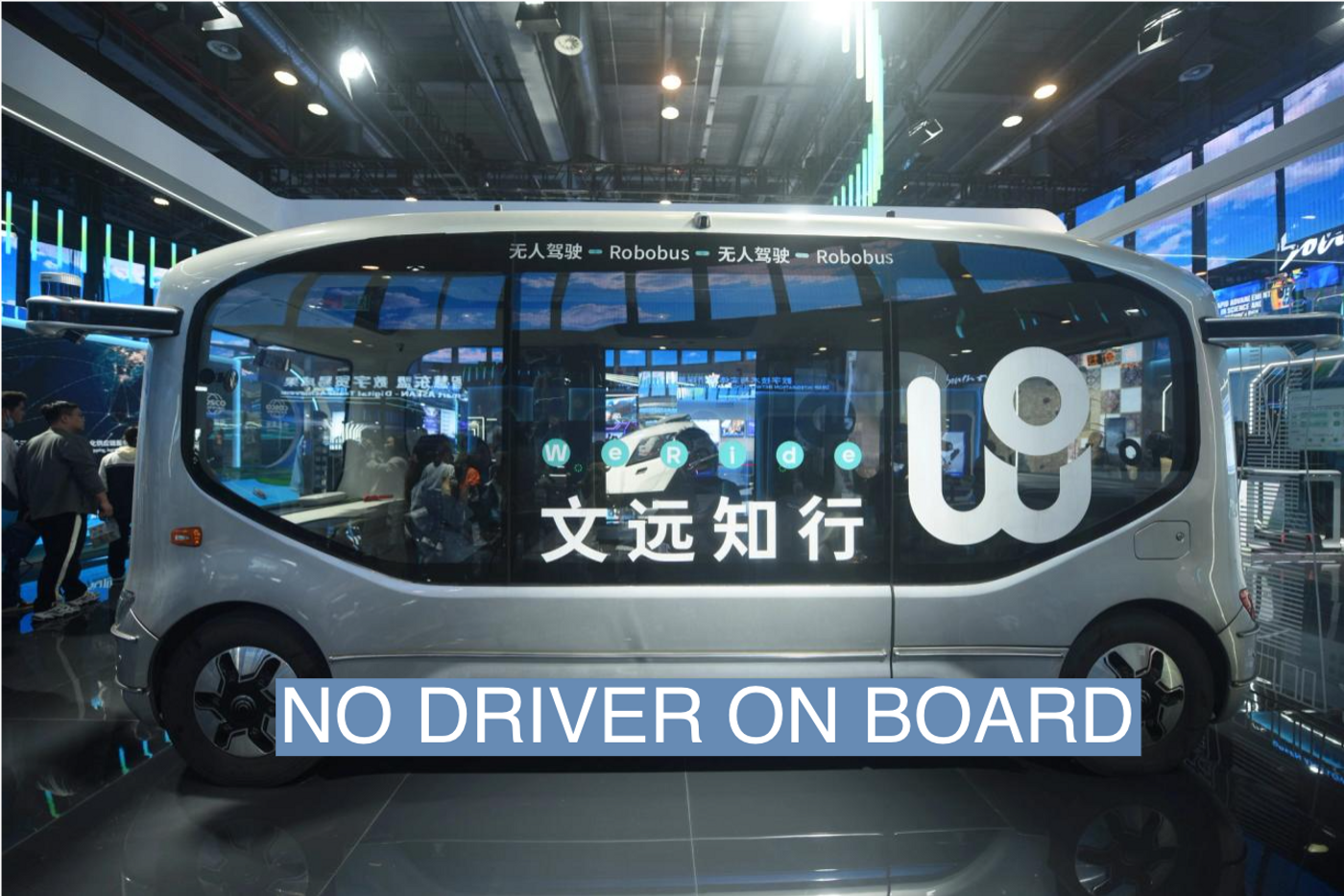 HANGZHOU, CHINA - NOVEMBER 23, 2023 - Visitors look at WeRide's driverless minibus at the 2nd Global Digital Trade Fair 2023 in Hangzhou, Zhejiang province, China, Nov 23, 2023. 