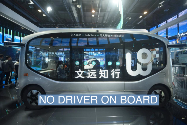 HANGZHOU, CHINA - NOVEMBER 23, 2023 - Visitors look at WeRide’s driverless minibus at the 2nd Global Digital Trade Fair 2023 in Hangzhou, Zhejiang province, China, Nov 23, 2023.
