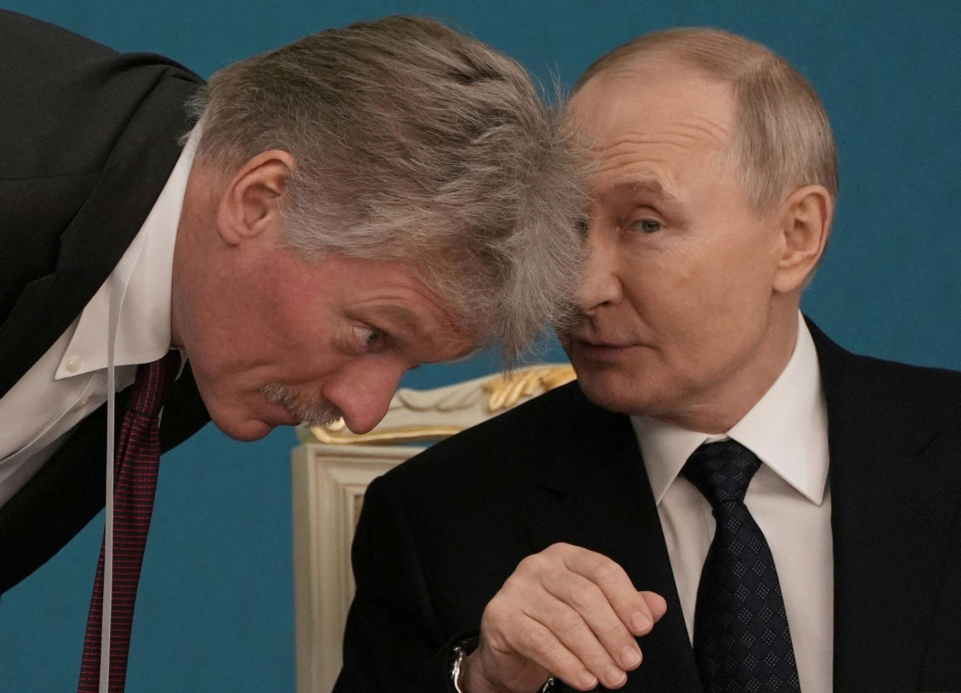 President Vladimir Putin speaks with a Kremlin spokesperson.