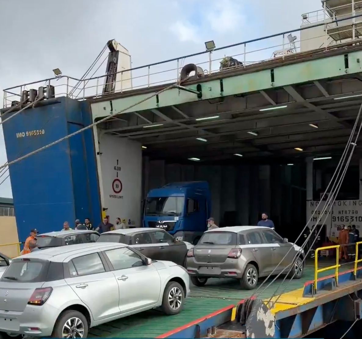 Cars being loaded on a ship in Syria.