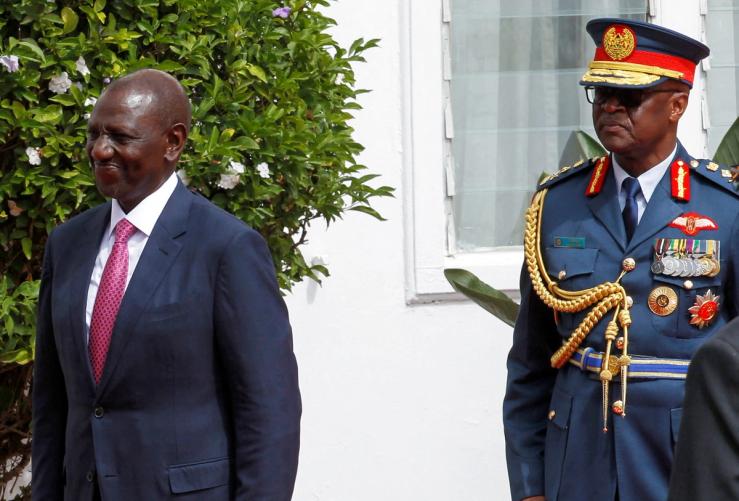 Kenya’s President William Ruto is escorted by Francis Ogolla (R), Chief of Kenya Defence Forces.