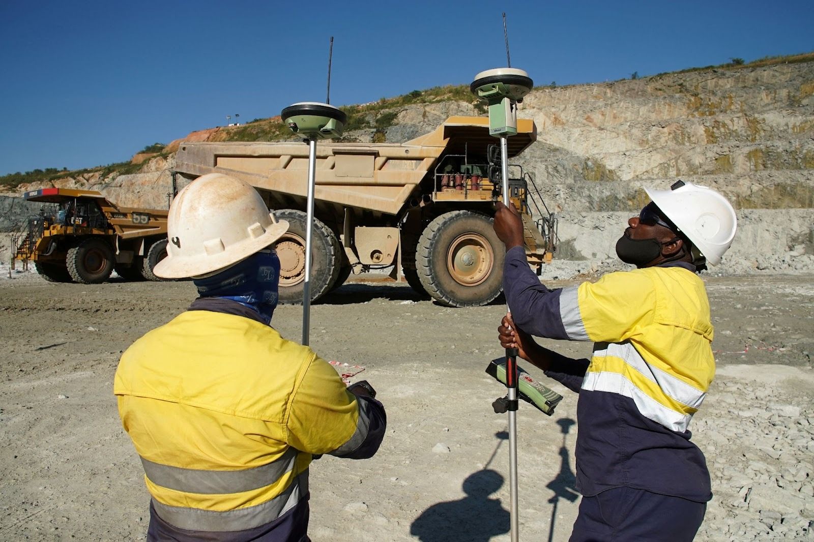 Miners check their surveying equipment at the Kibali gold mine in DR Congo on Oct. 8, 2021. 