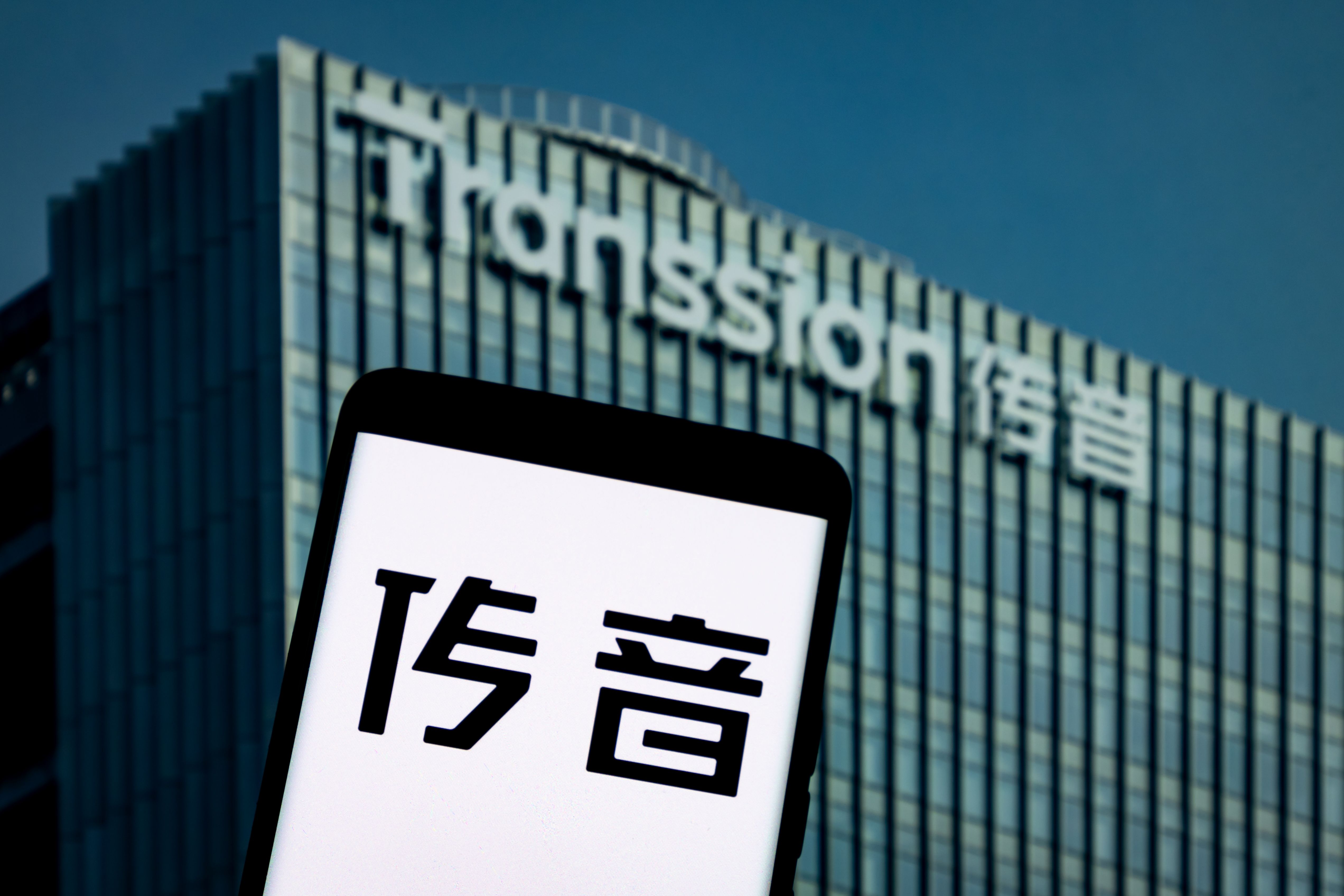 An illustration photo shows the TRANSSION logo displayed on a smartphone in Chongqing, China on April 24, 2025. 