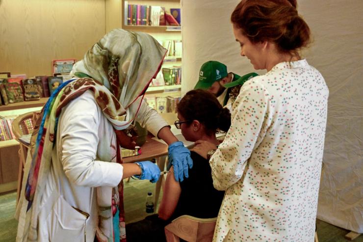 A health worker administers human papillomavirus (HPV) vaccine to a girl in Karachi on September 24, 2025, during a HPV vaccination drive against cervical cancer, most frequently diagnosed in women.