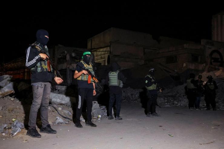 Hamas militants stand guard in Gaza.