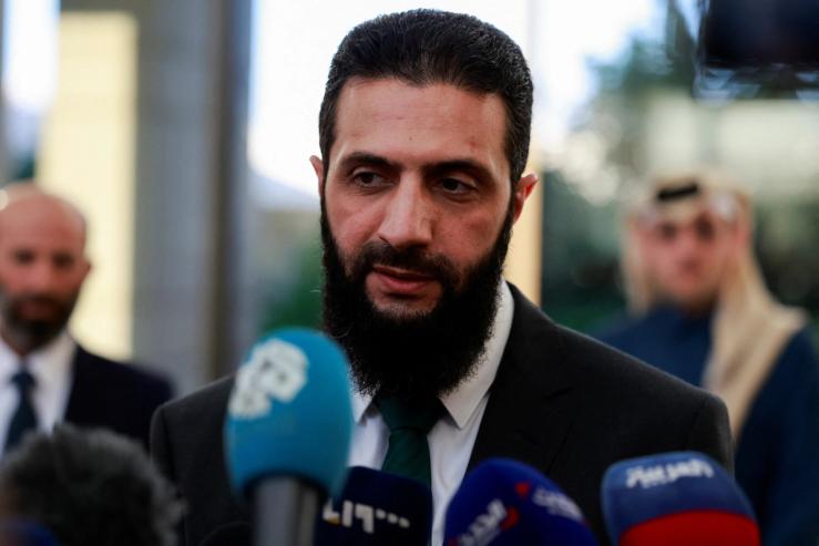 Syria’s de facto leader Ahmed al-Sharaa speaks to the media during a meeting with Qatar’s Minister of State.