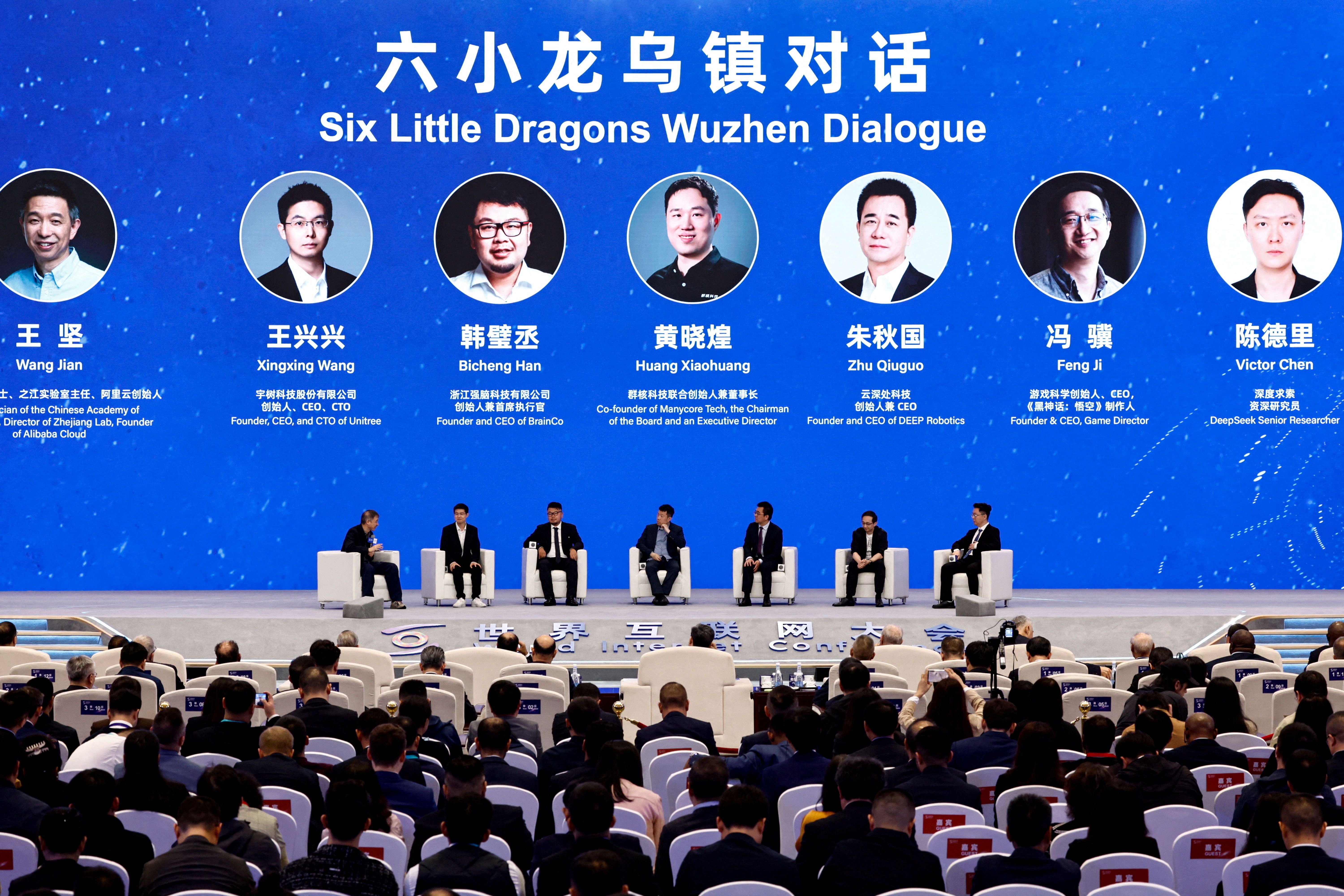 Founder, CEO and CTO of Unitree Wang Xingxing, founder and CEO of BrainCo Han Bicheng, co-founder of Manycore Tech Huang Xiaohuang, founder and CEO of DEEP Robotics Zhu Qiuguo, founder and CEO of Game Science Feng Ji, Deepseek Senior Researcher Victor Chen and founder of Alibaba Cloud Wang Jian attend the Six Little Dragons Wuzhen Dialogue, at the World Internet Conference, in Wuzhen town of Tongxiang city, Zhejiang province, China 