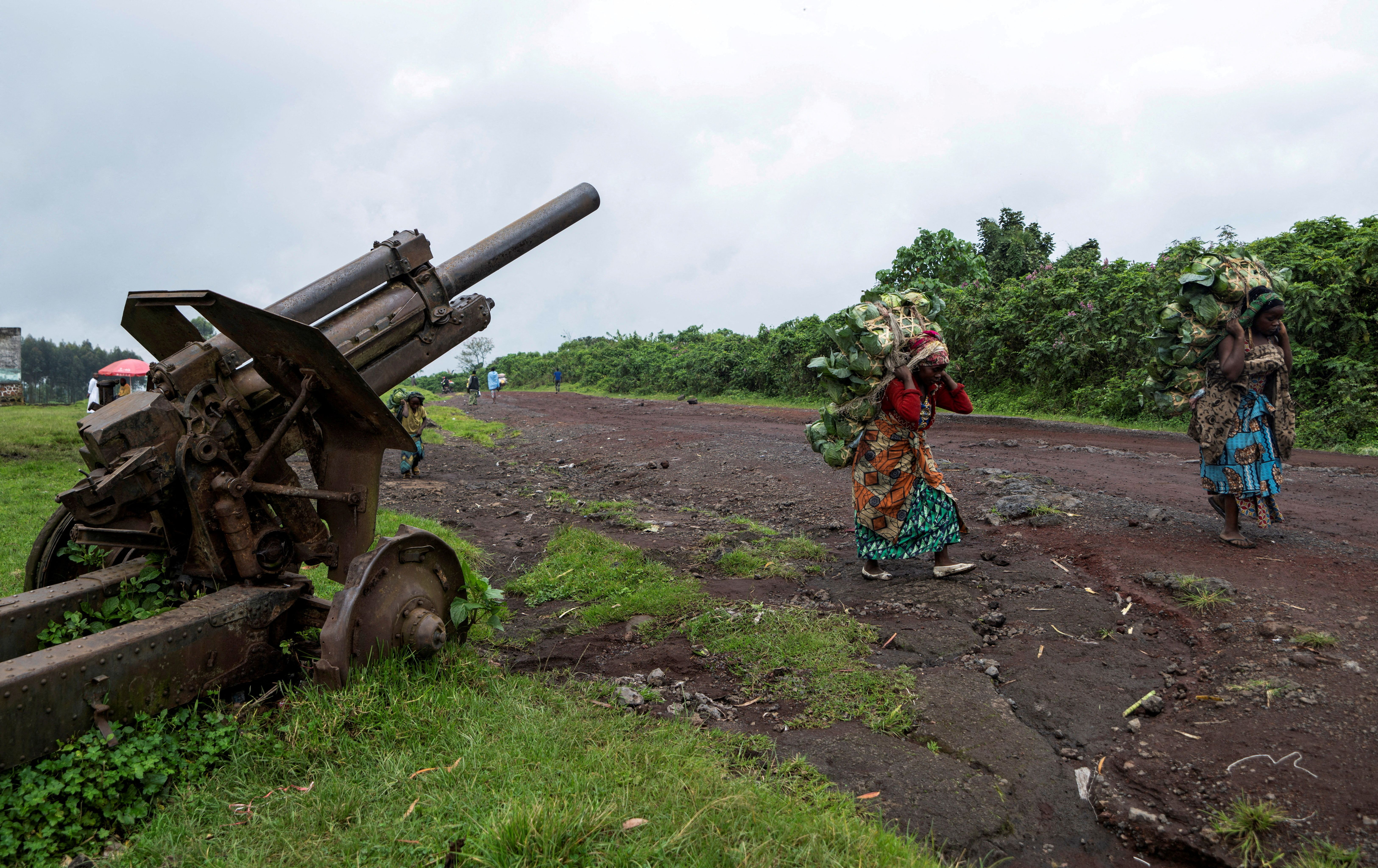 Two women carry fresh cabbages to the market in eastern Democratic Republic of Congo.