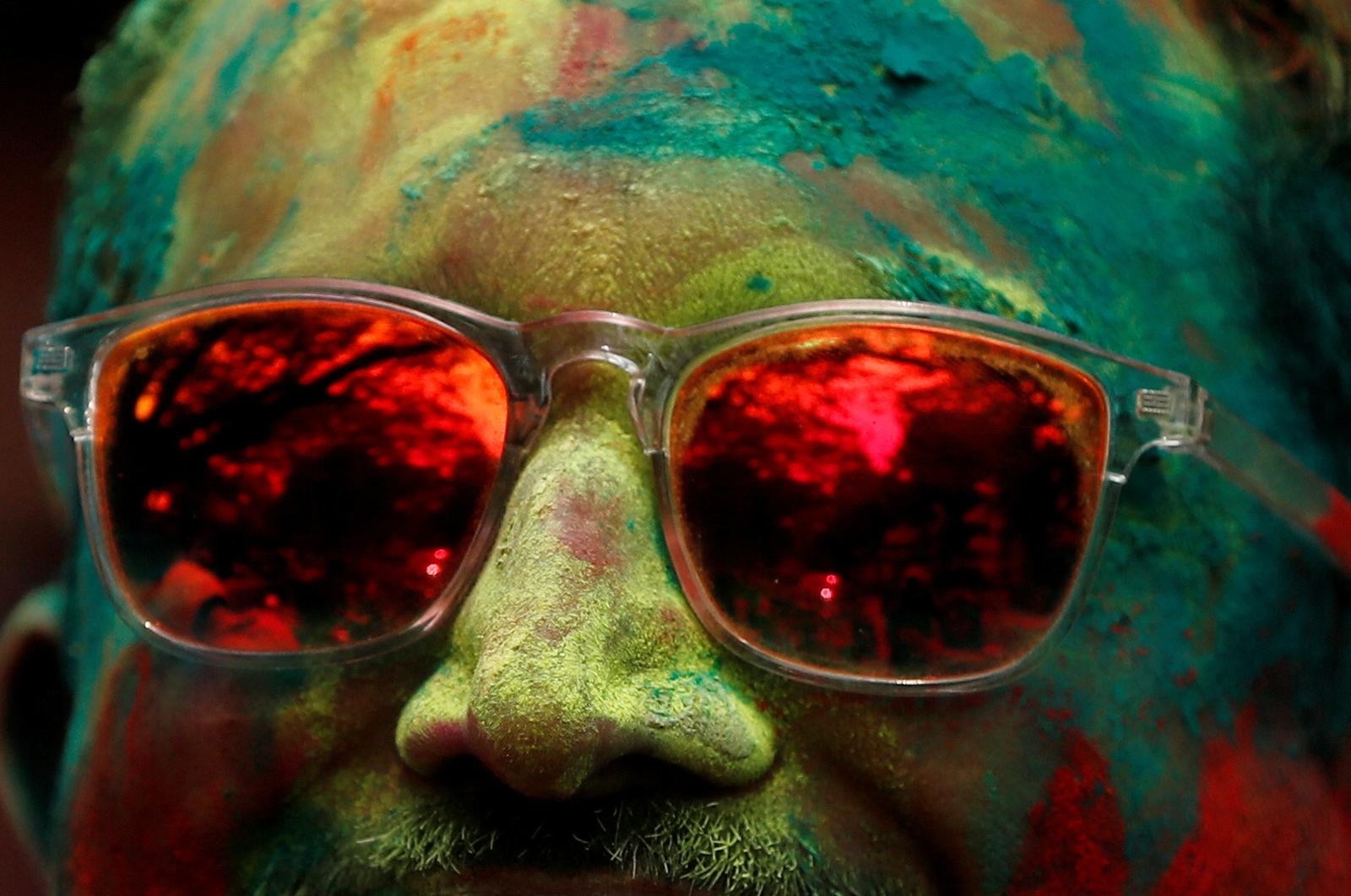 A man attends Holi celebrations in Mumbai, India, March 7, 2023. REUTERS/Francis Mascarenhas