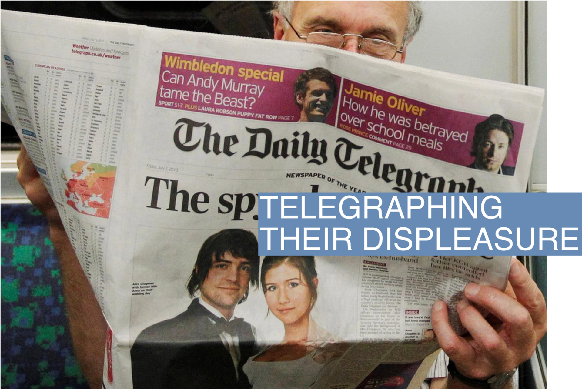 A passenger reads the Daily Telegraph newspaper, featuring a front page interview with the ex-husband of accused Russian spy Anna Chapman, on the underground in London July 2, 2010. REUTERS/Luke MacGregor/File Photo