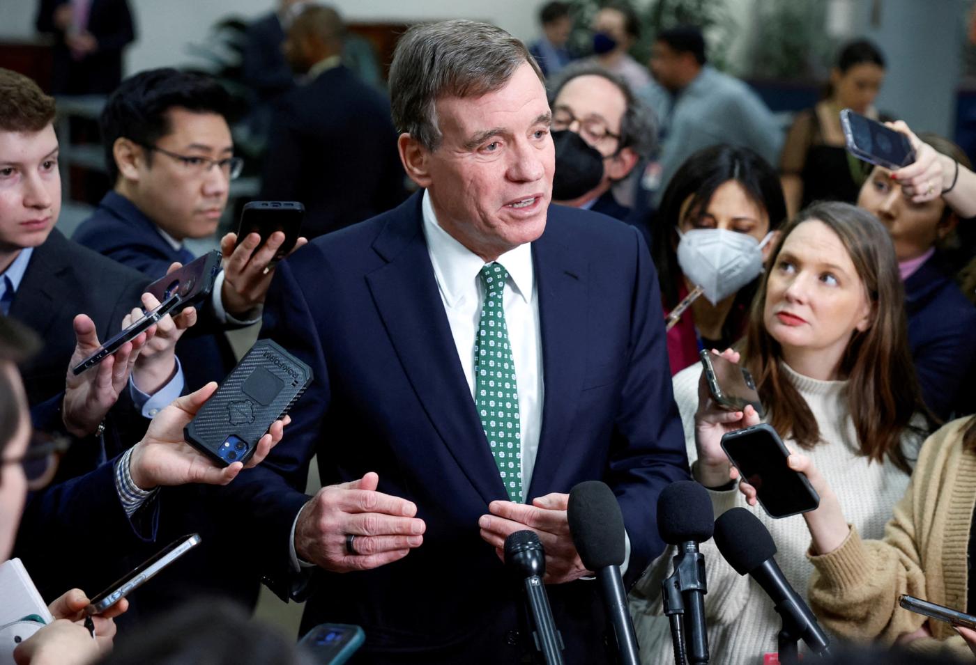 U.S. Senator Mark Warner (D-VA) speaks to the media following a classified briefing for U.S. Senators about the latest unknown objects shot down by the U.S. military, on Capitol Hill in Washington, U.S., February 14, 2023.