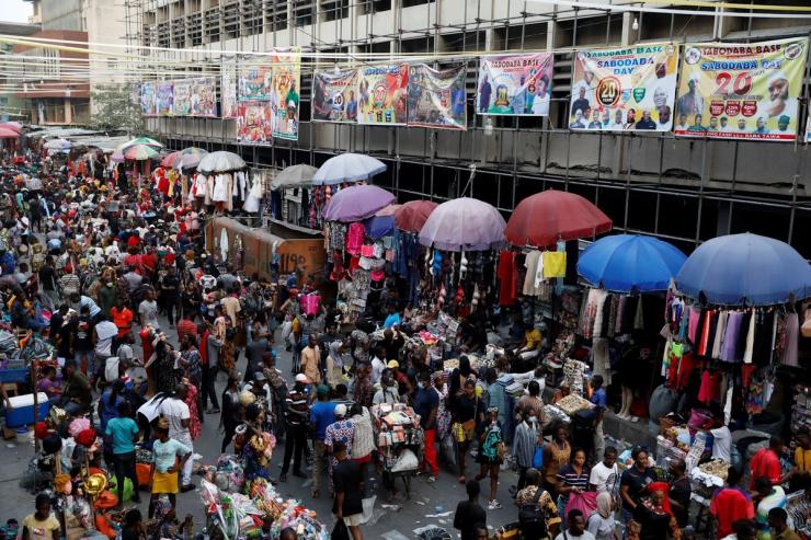 People crowd a market place as they shop in preparation for Christmas in Lagos, Nigeria on Dec.18, 2021.
