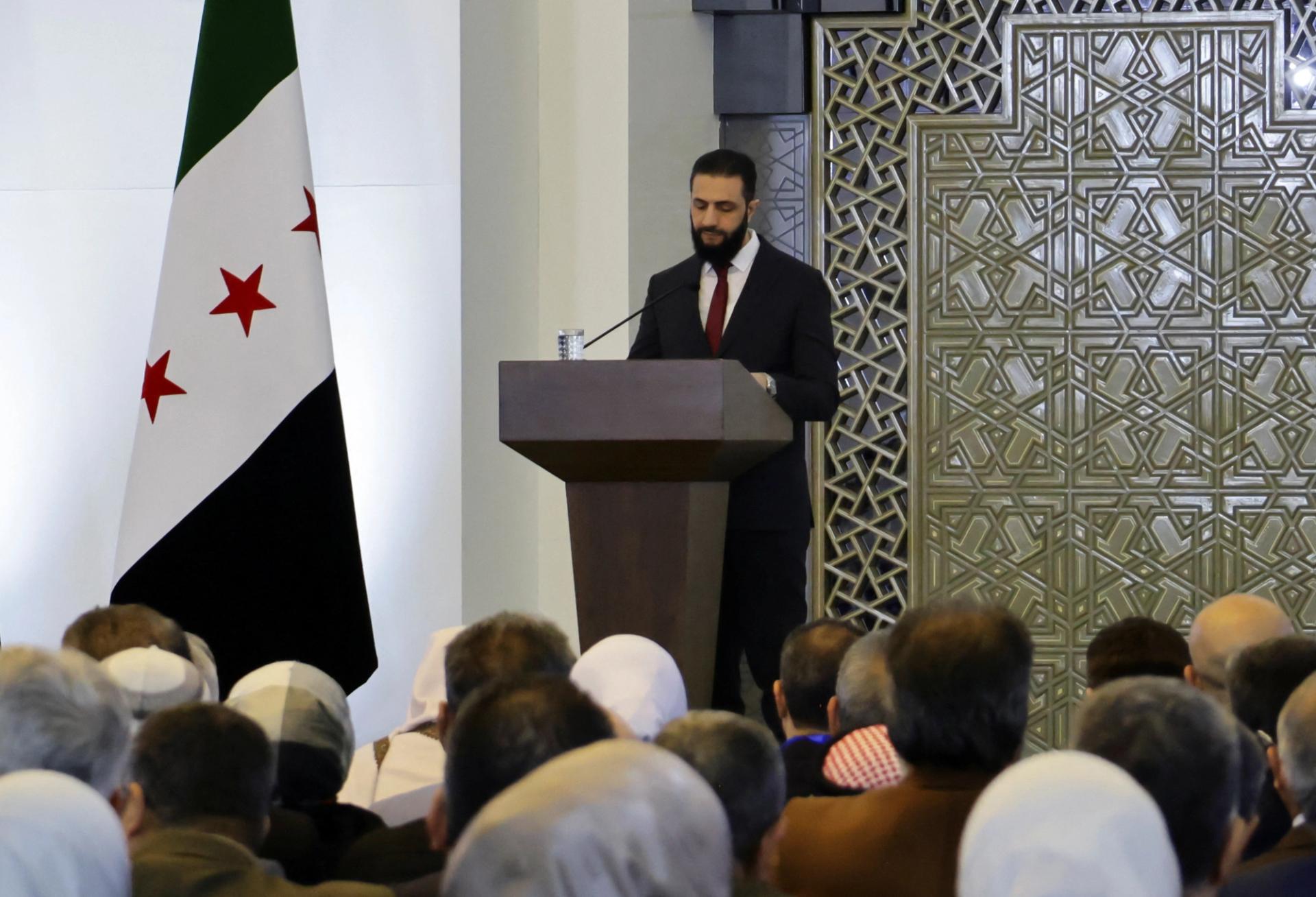 Syria’s interim President Ahmed al-Sharaa speaks during a national dialogue.