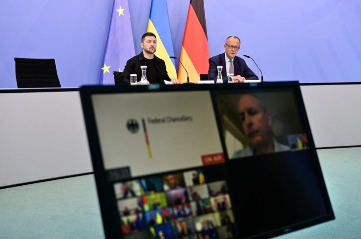 Ukrainian President Volodymyr Zelensky and German Chancellor Friedrich Merz attend a video conference of European and world leaders.