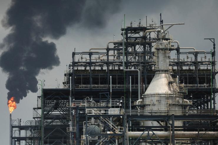 A flame rises from a gas flare at the Dangote oil refinery and fertilizer plant site.