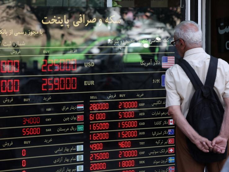 A sign showing currency exchange rates in Tehran