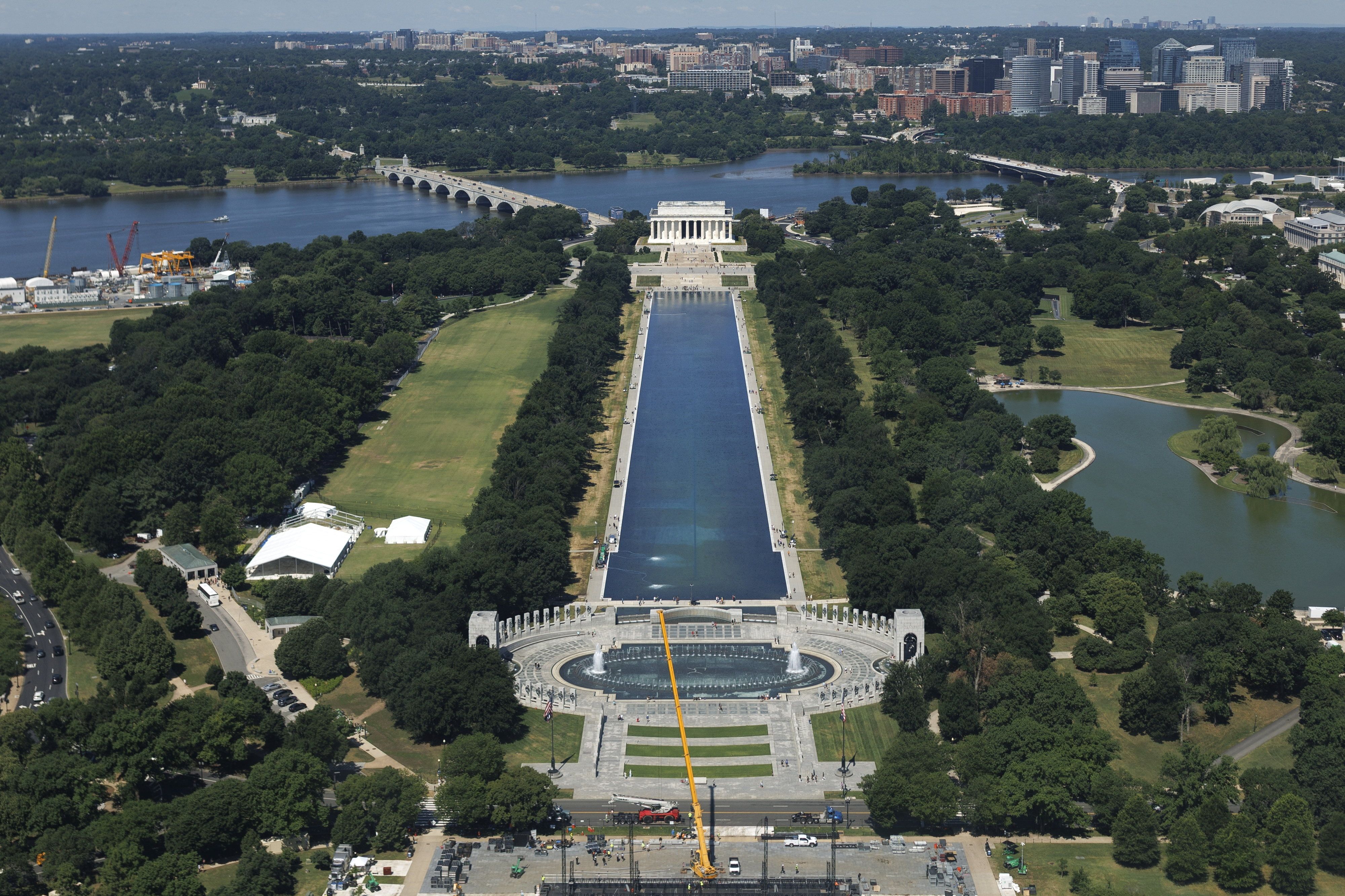 Visitors walk along the Lincoln Memorial Reflecting Pool 