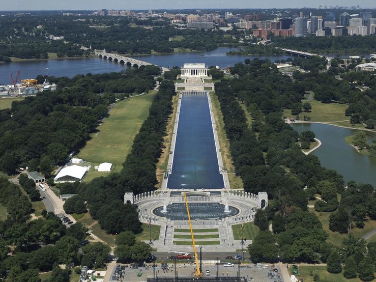 Visitors walk along the Lincoln Memorial Reflecting Pool