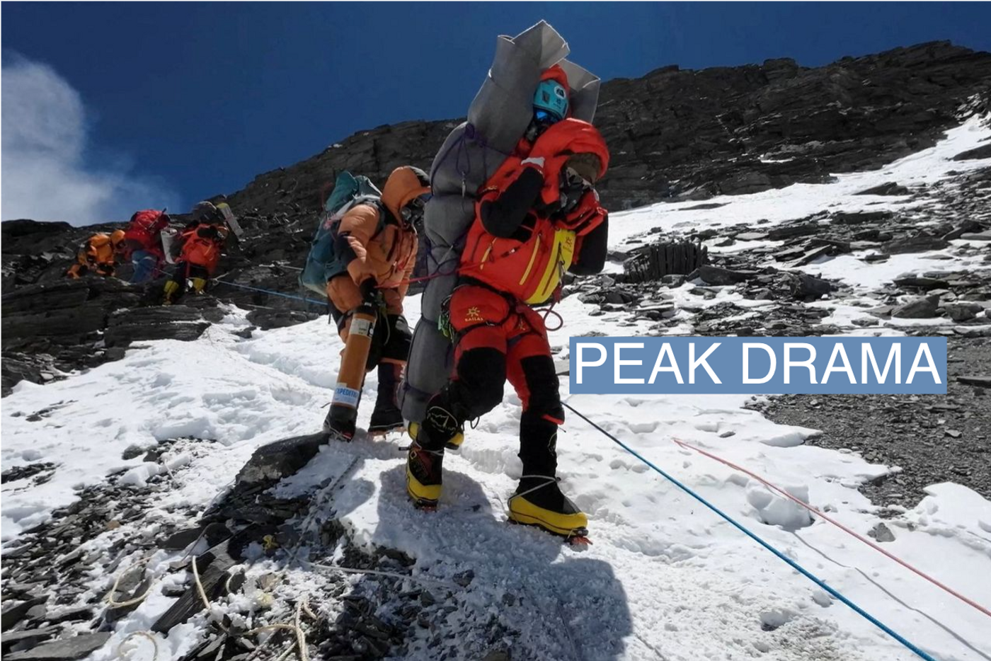 Ngima Tashi Sherpa walks as he carries a Malaysian climber while rescuing him from the death zone above camp four at Everest, Nepal, May 18, 2023 in this screengrab obtained from a handout video. Gelje Sherpa/Handout via REUTERS
