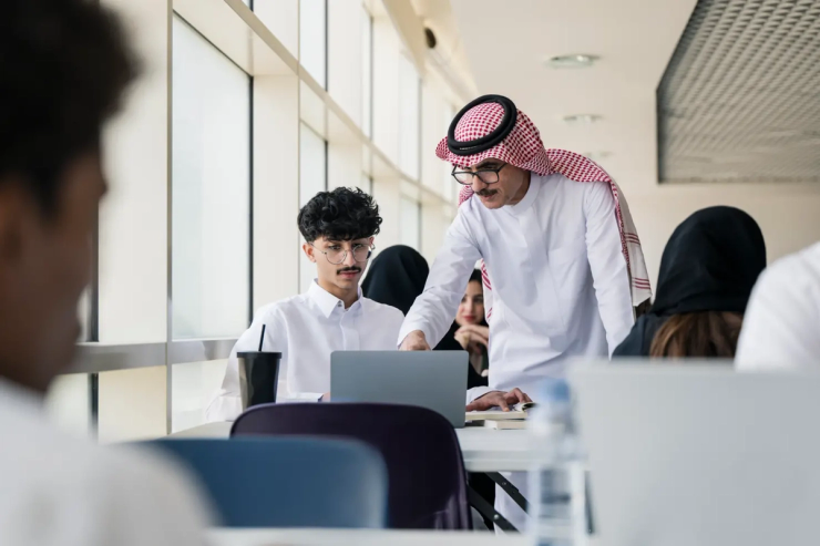 A Saudi teacher with pupils at school.