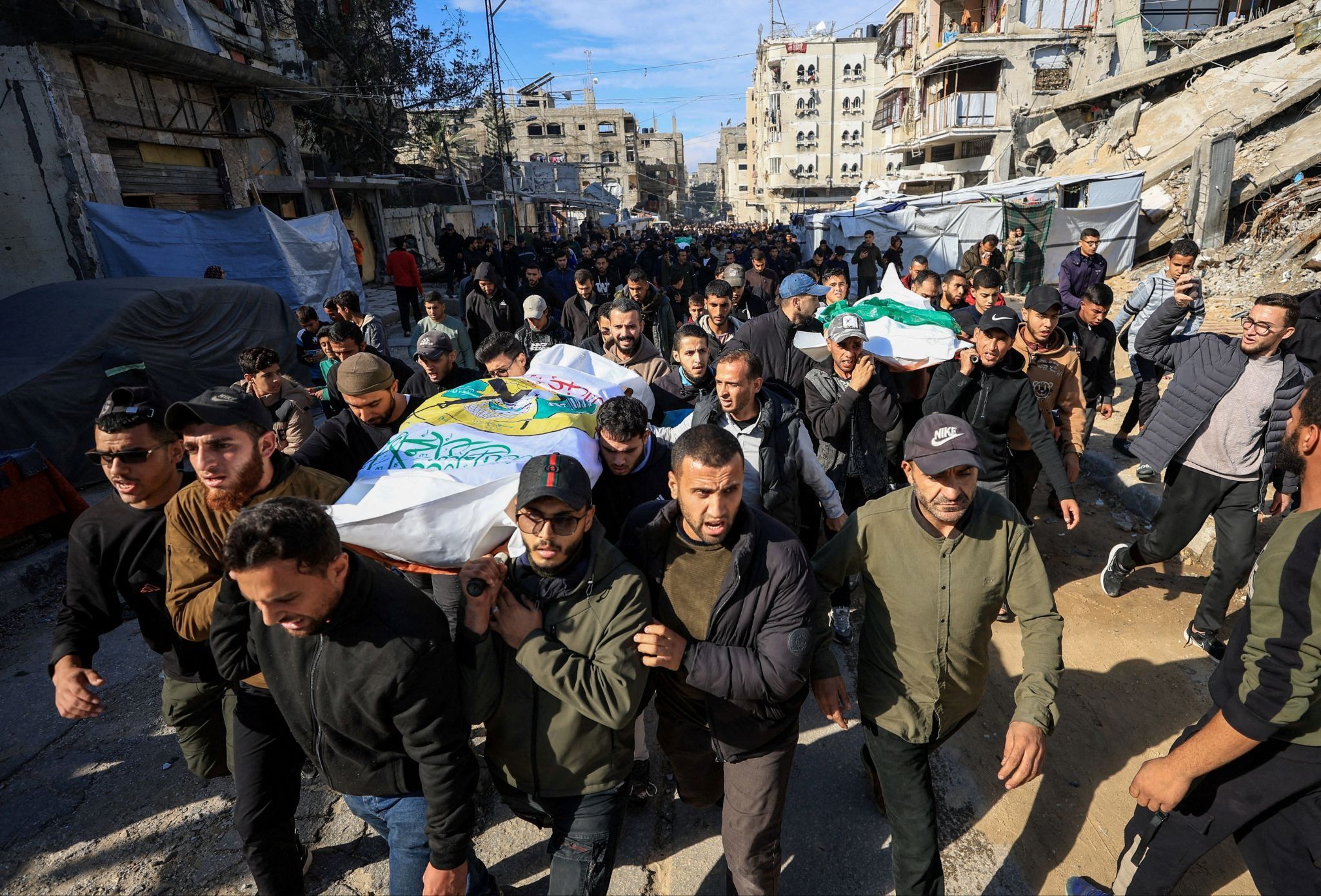 Bodies are carried during a funeral in Gaza