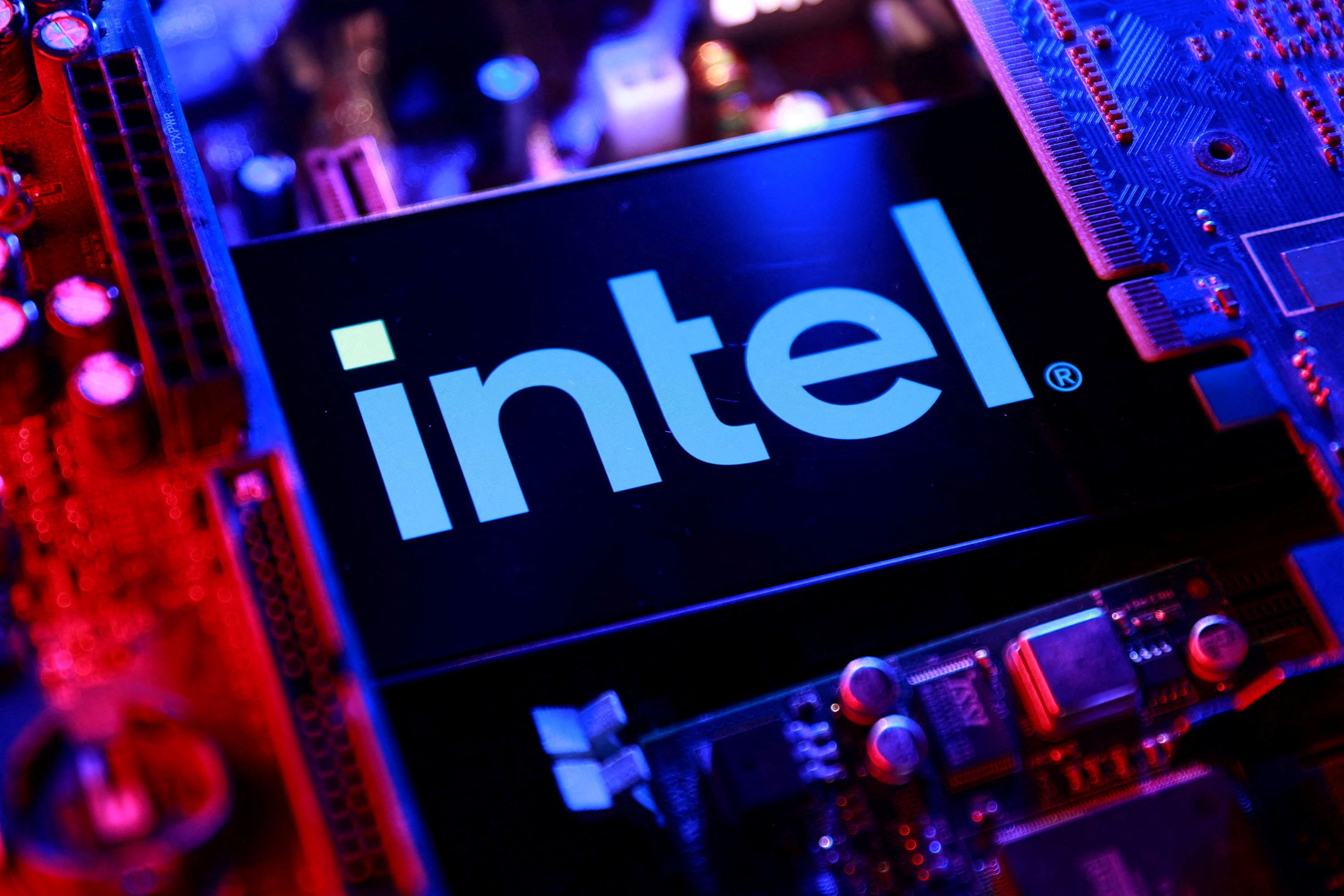 Illustration shows Intel logo and computer motherboard.