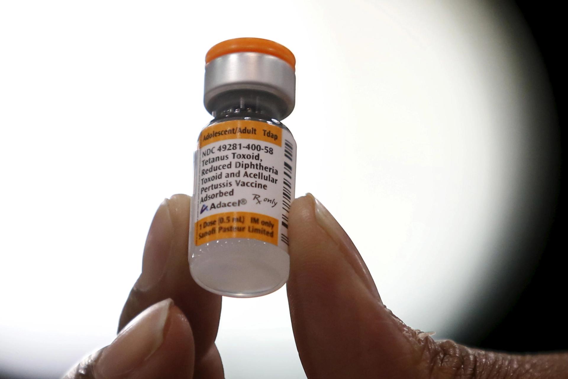 A nurse displays a tetanus, diphtheria and pertussis whooping cough vaccine in LA.