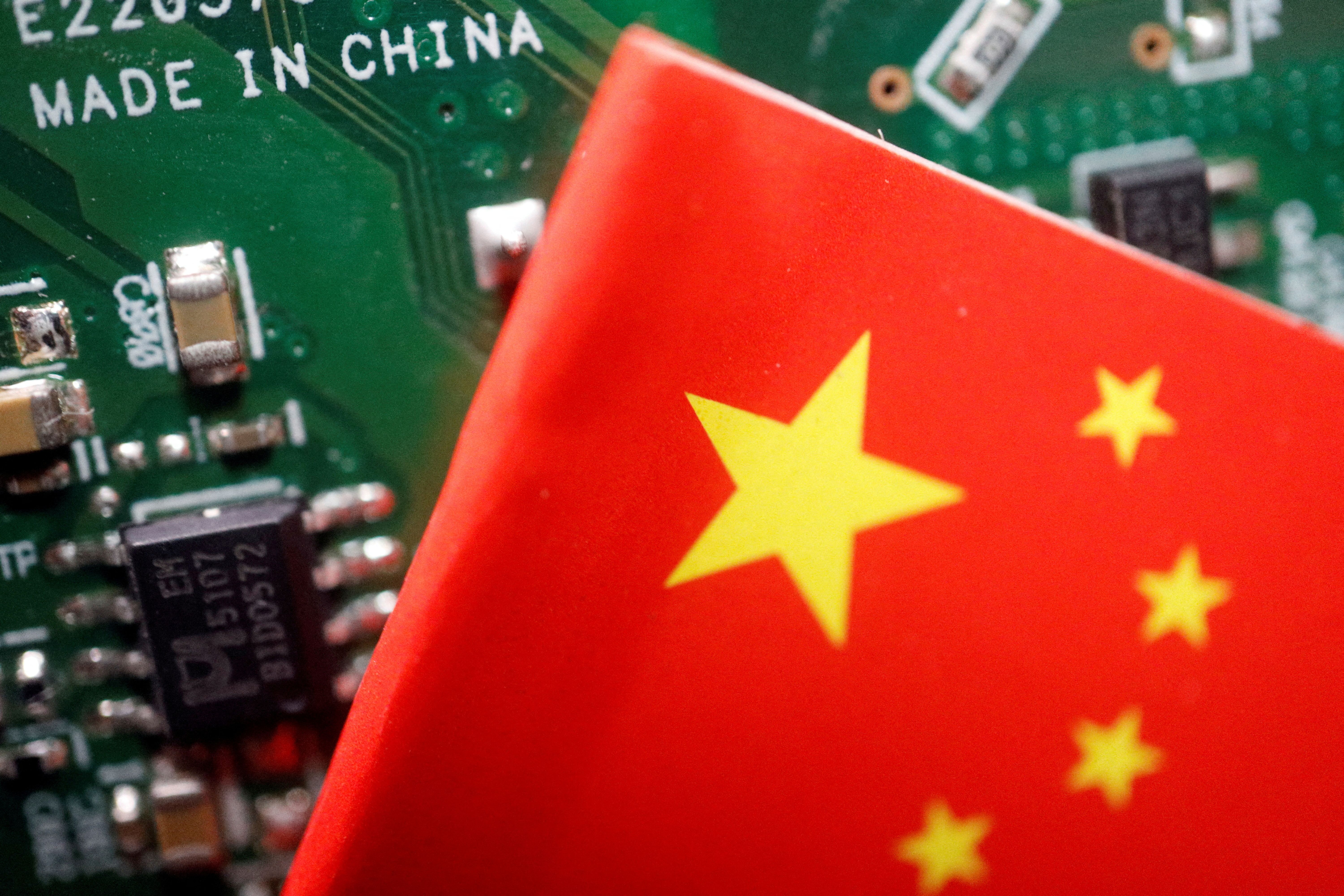A Chinese flag seen on a printed circuit board with semiconductor chips