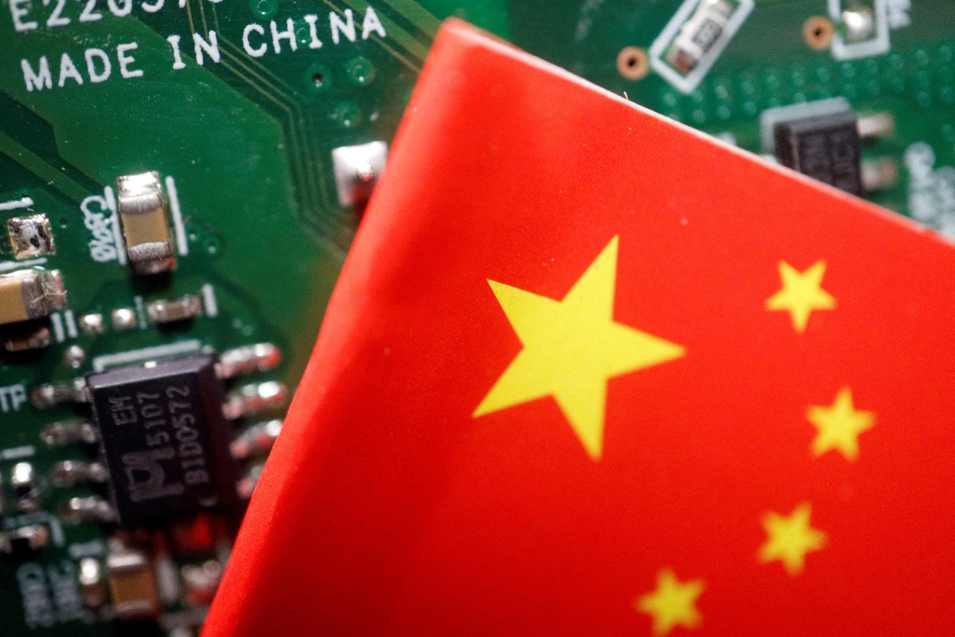 A Chinese flag seen on a printed circuit board with semiconductor chips