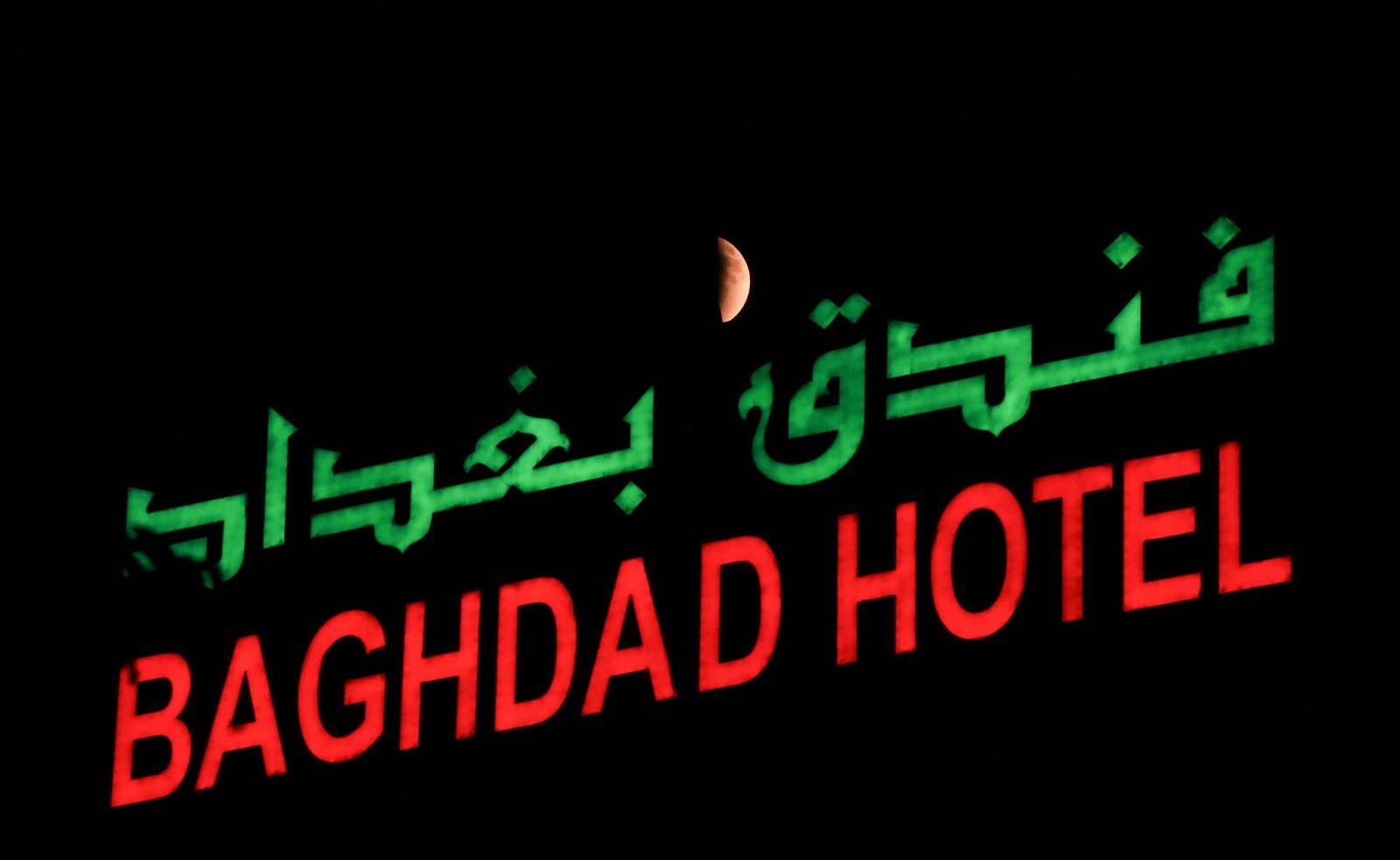 The “Blood Moon” rises in the sky during a total lunar eclipse,in Baghdad.