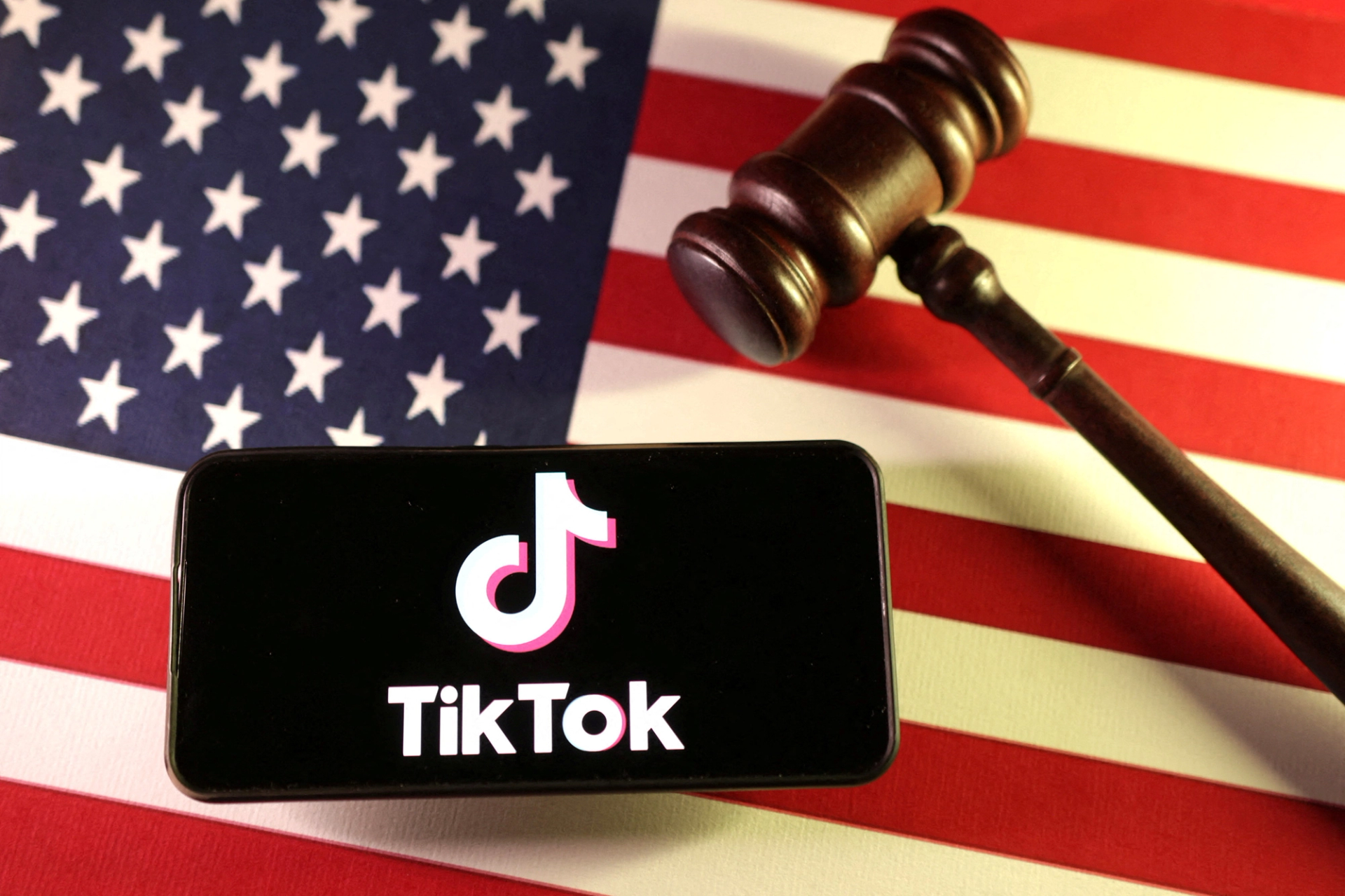 An illustration showing the TikTok app and an American flag.