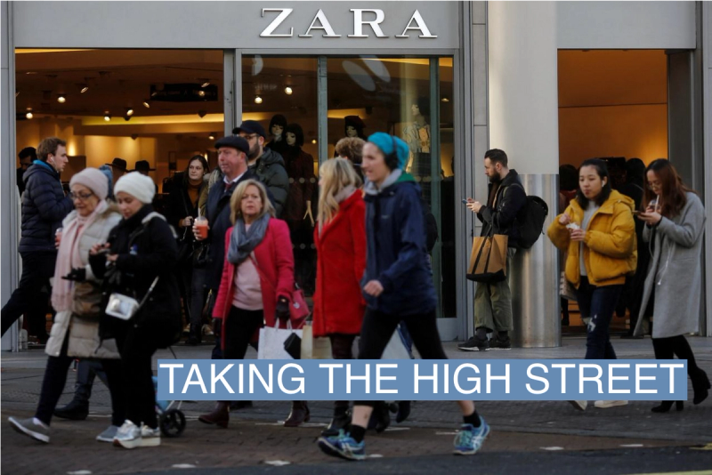 Shoppers walk past a Zara Store on Oxford Street in London, Britain