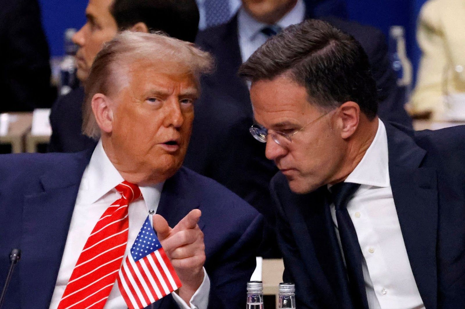 US President Donald Trump speaks with NATO Secretary General Mark Rutte as they attend the North Atlantic Council plenary meeting at the North Atlantic Treaty Organisation (NATO) summit in The Hague on June 25, 2025.