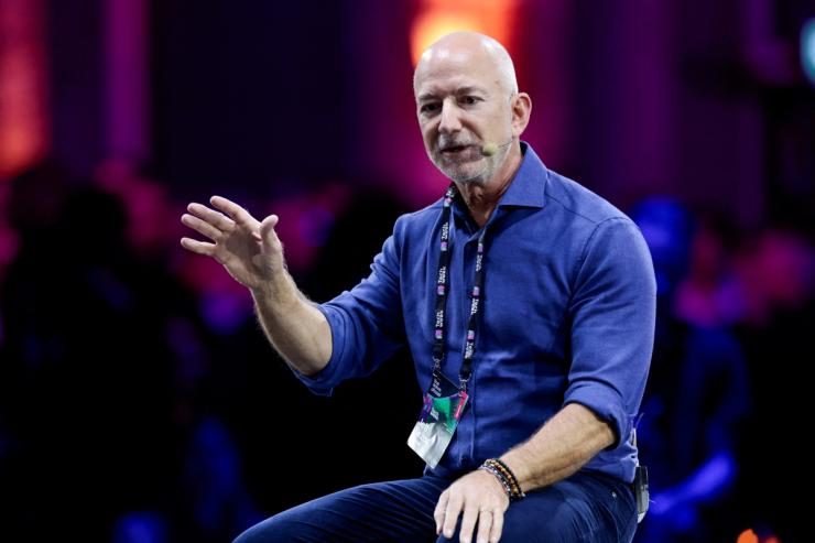 Amazon founder Jeff Bezos gestures as he speaks at the main panel of Italian Tech Week 2025 in Turin, Italy.