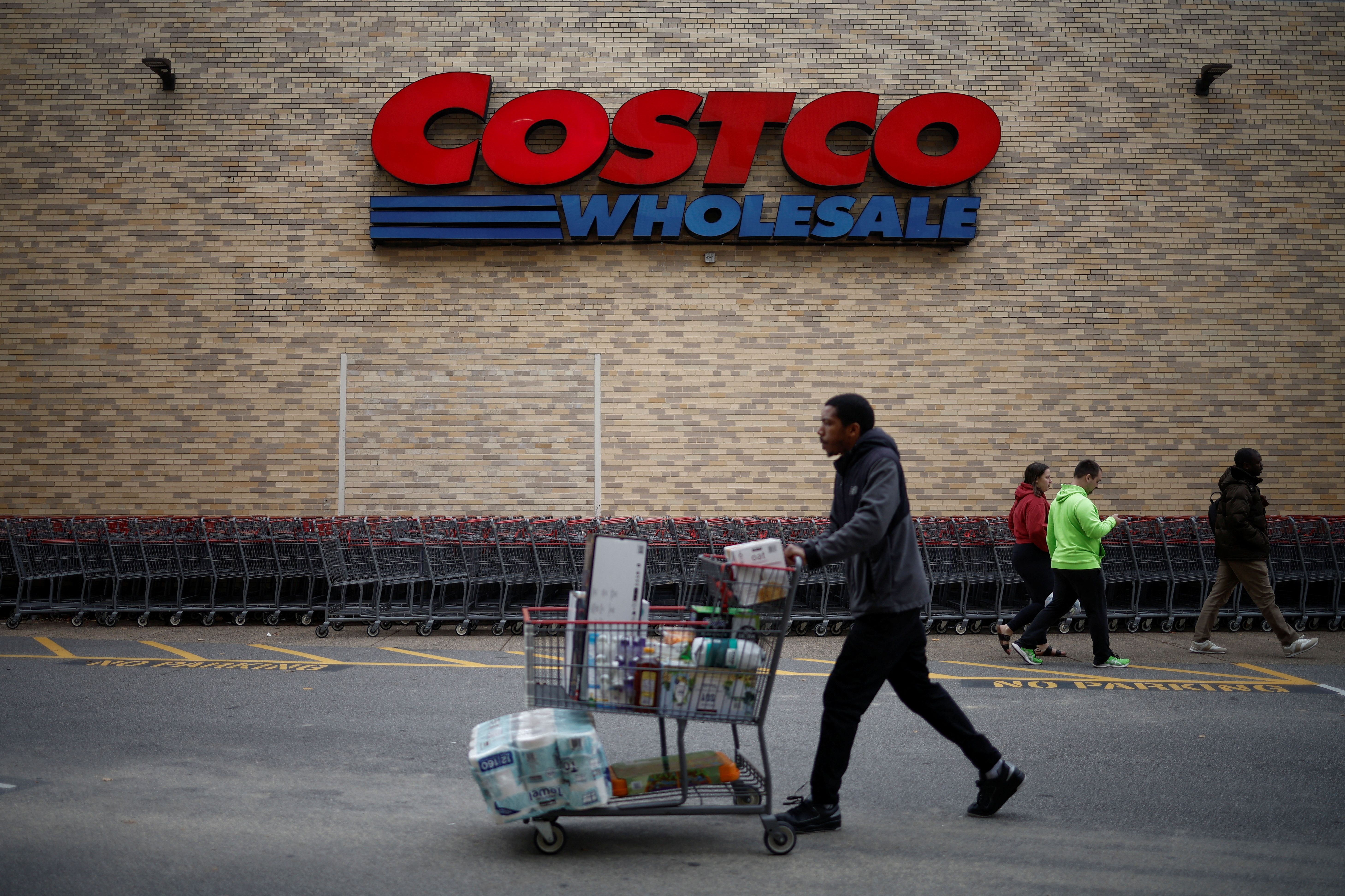 A shopper pushes a shopping cart at a Costco store ahead of Black Friday in Arlington, Virginia.