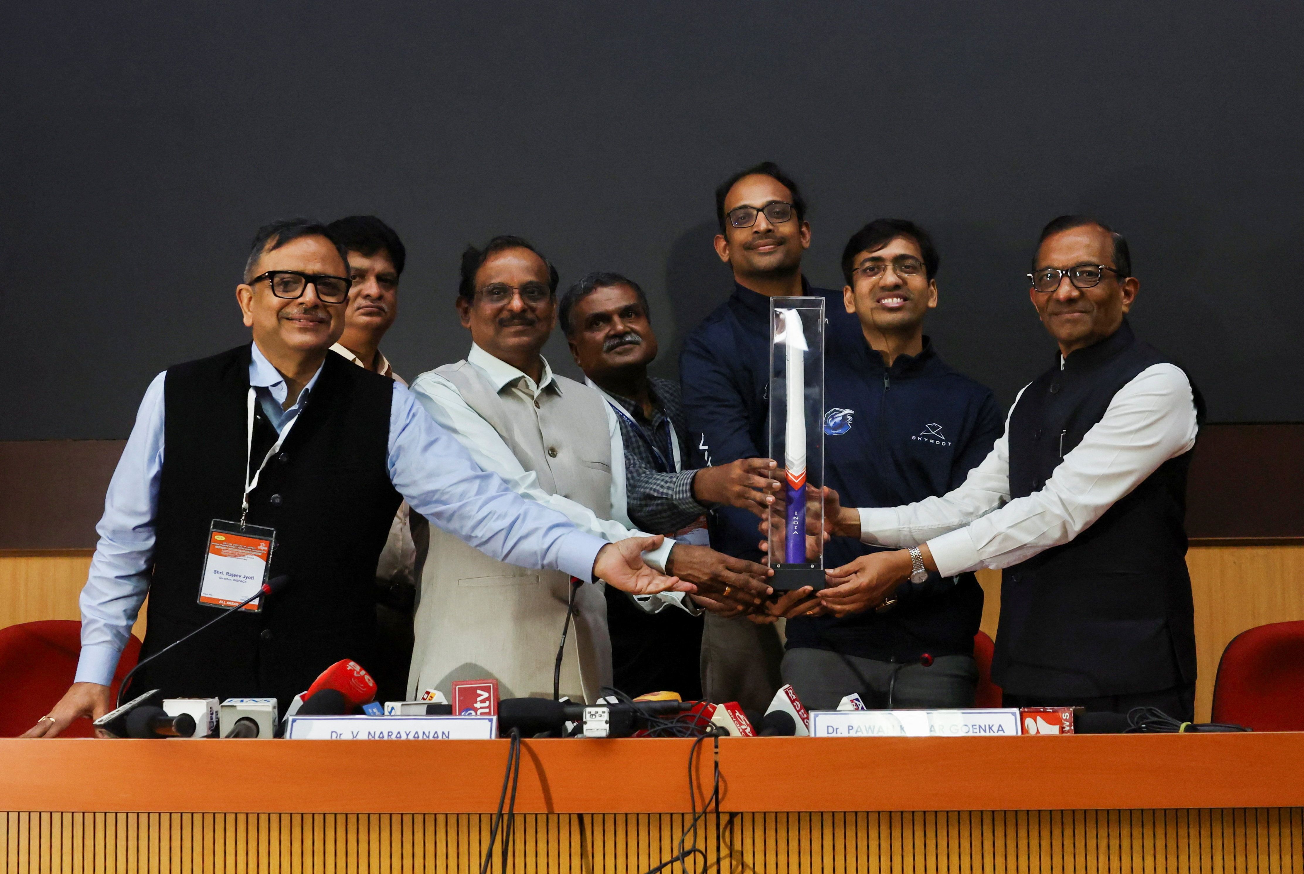 V. Narayanan, Chairman of the Indian Space Research Organisation, Pawan Goenka, Chairman of IN-SPACe, Pawan Kumar Chandana, Co-founder and CEO of Skyroot Aerospace, and Naga Bharath Daka, Co-founder and COO of Skyroot Aerospace, pose with a model of the Vikram-1 rocket after a press briefing following the successful launch of Skyroot Aerospace’s Vikram-1 rocket into orbit, making it the first Indian private company to place a satellite in orbit, at the Satish Dhawan Space Centre in Sriharikota