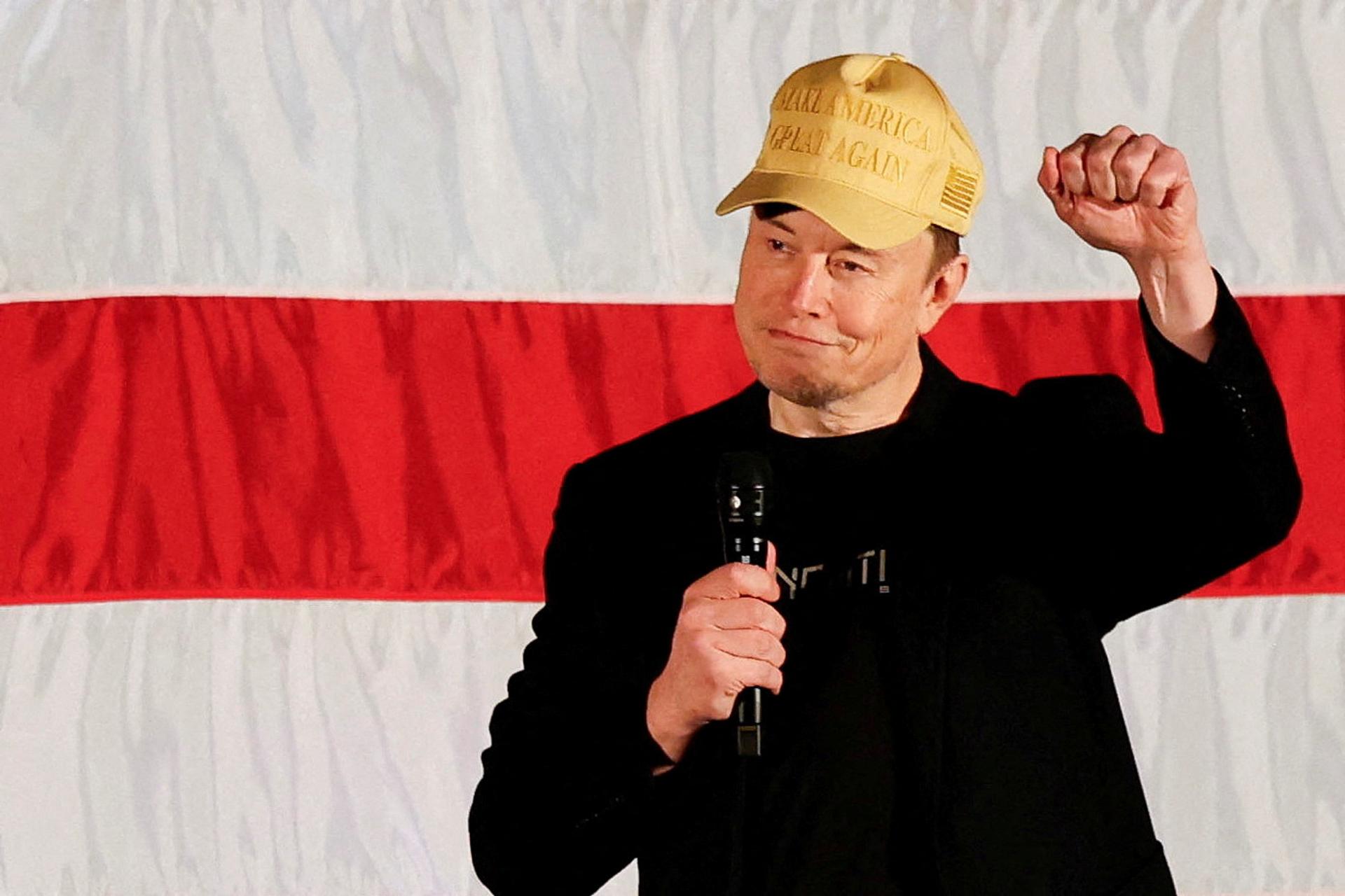 Tesla CEO and X owner Elon Musk gestures as he speaks about voting during an America PAC Town Hall in Folsom, Pennsylvania.