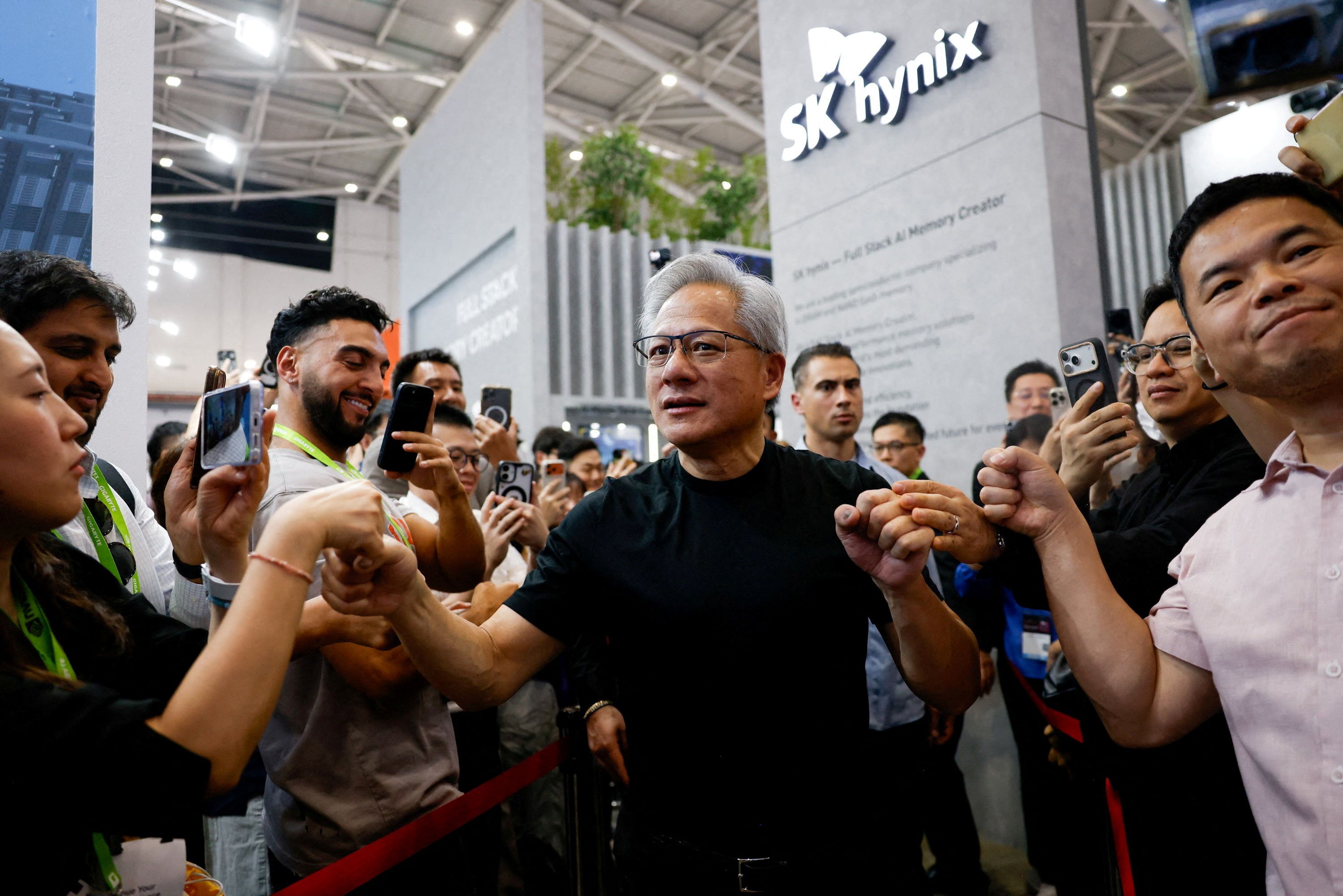 NVIDIA CEO Jensen Huang leaves the SK hynix booth during the annual Computex in Taipei, Taiwan.