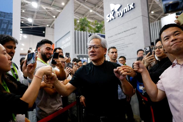 NVIDIA CEO Jensen Huang leaves the SK hynix booth during the annual Computex in Taipei, Taiwan.