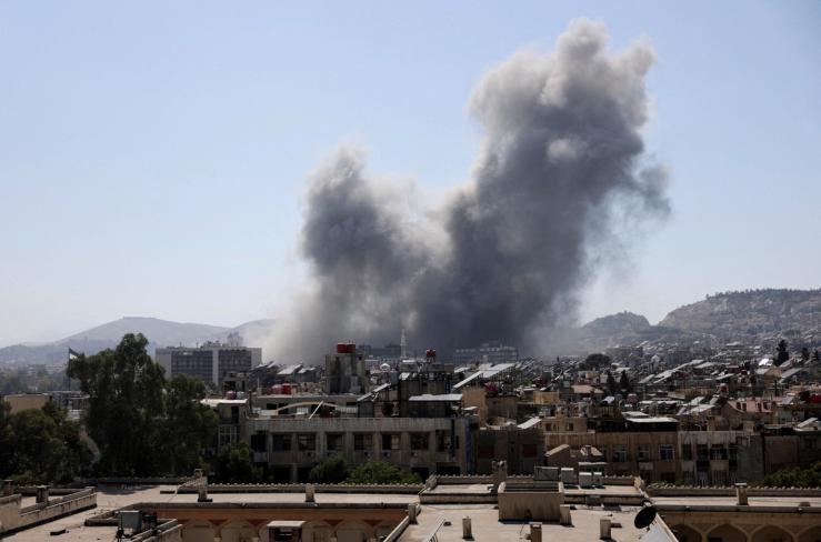 Smoke rises after strikes on Syria’s defense ministry in Damascus