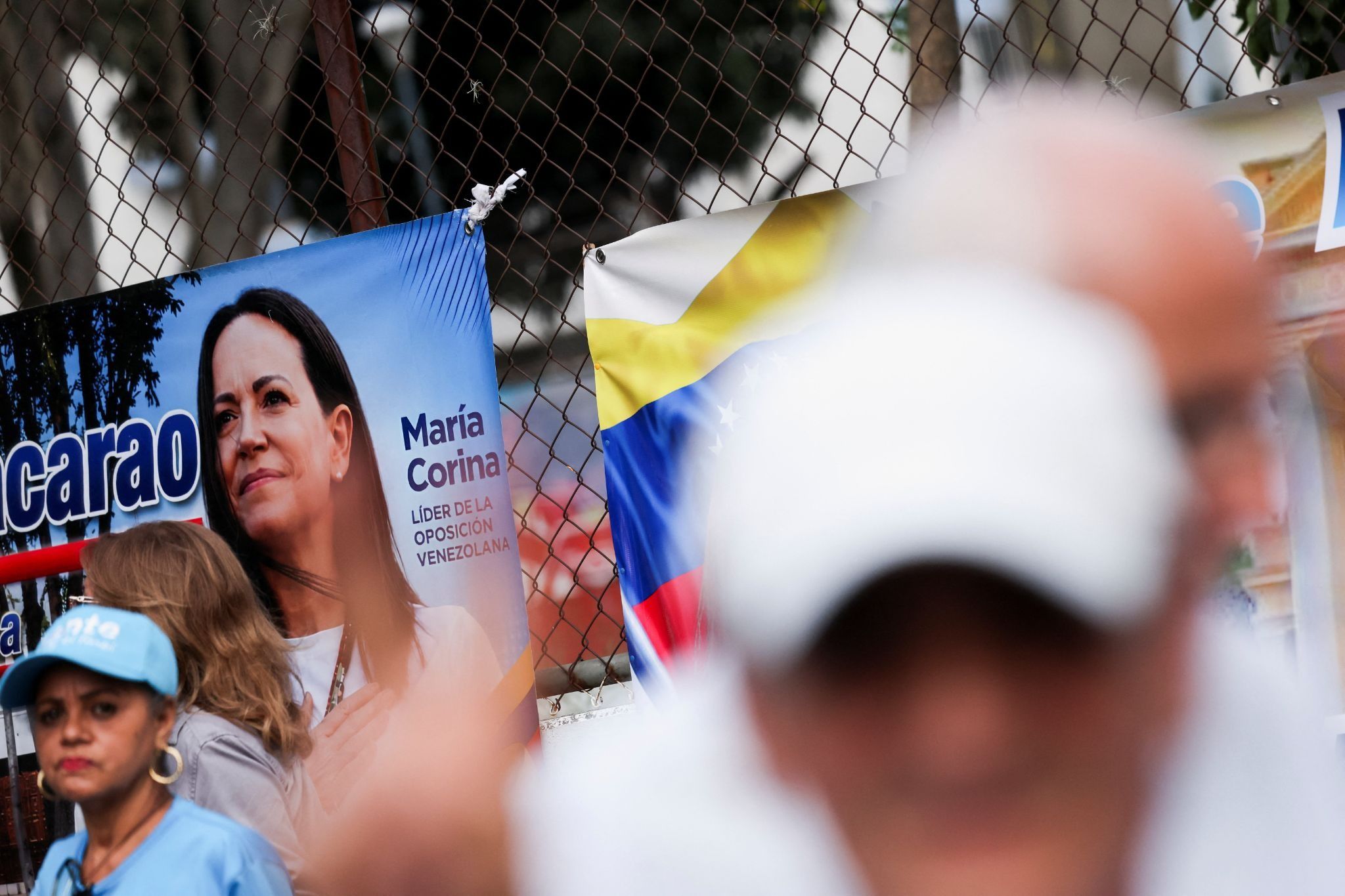 A banner with an image of opposition leader Maria Corina Machado.
