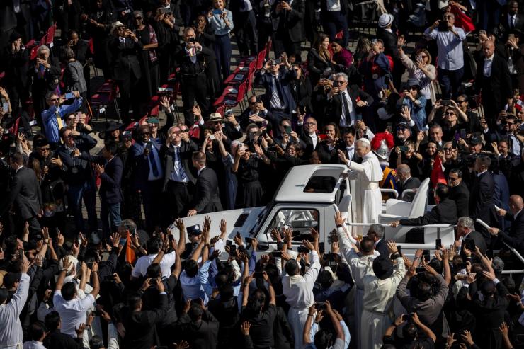 Pope Leo XIV arrives on the popemobile for his inaugural Mass at the Vatican.