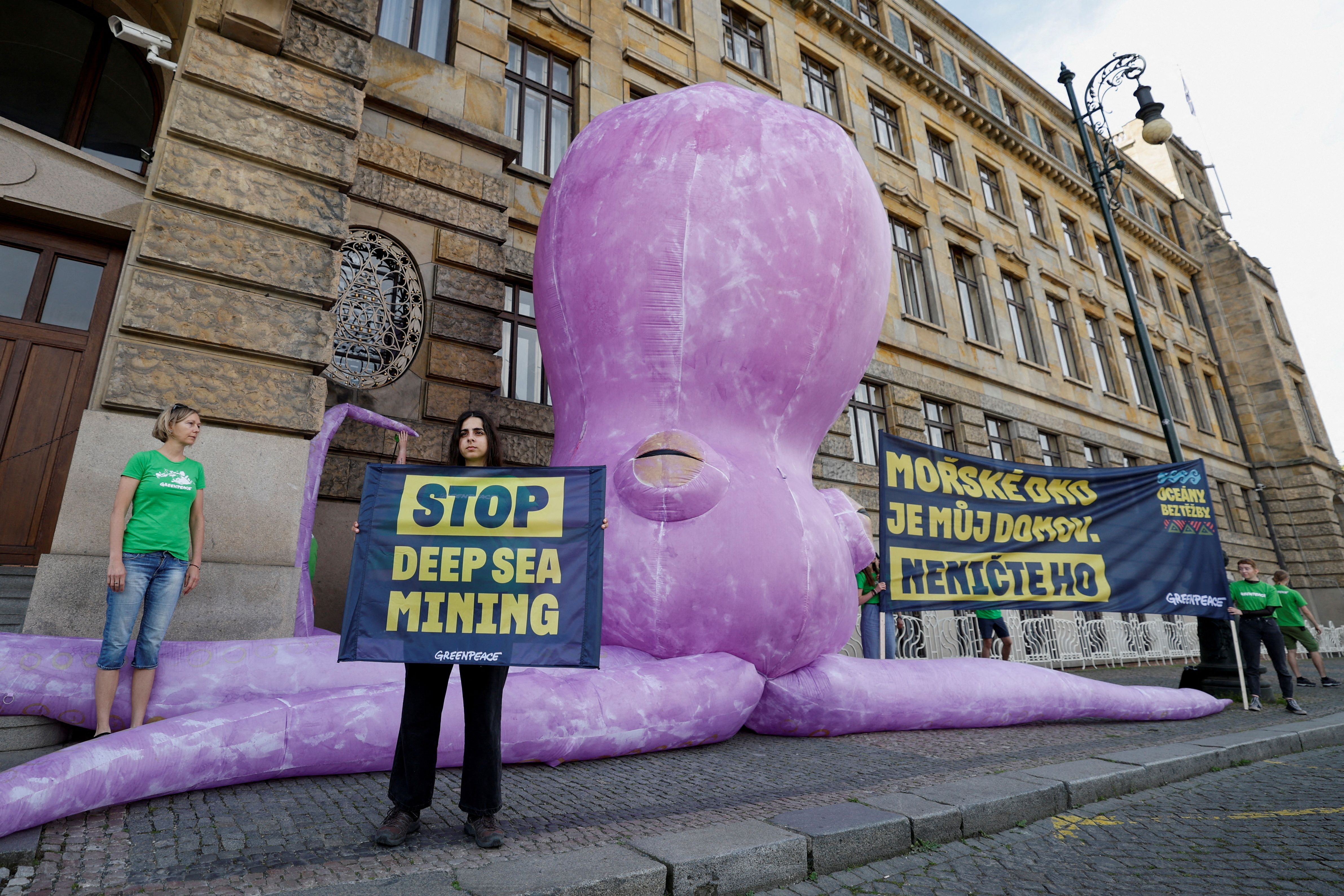 Greenpeace activists hold a protest demanding an end to deep sea mining, in front of the Ministry of Industry in Prague, Czech Republic, June 1, 2023. The banner reads: “The seabed is my home. Do not destroy it”. REUTERS/David W Cerny/File Photo