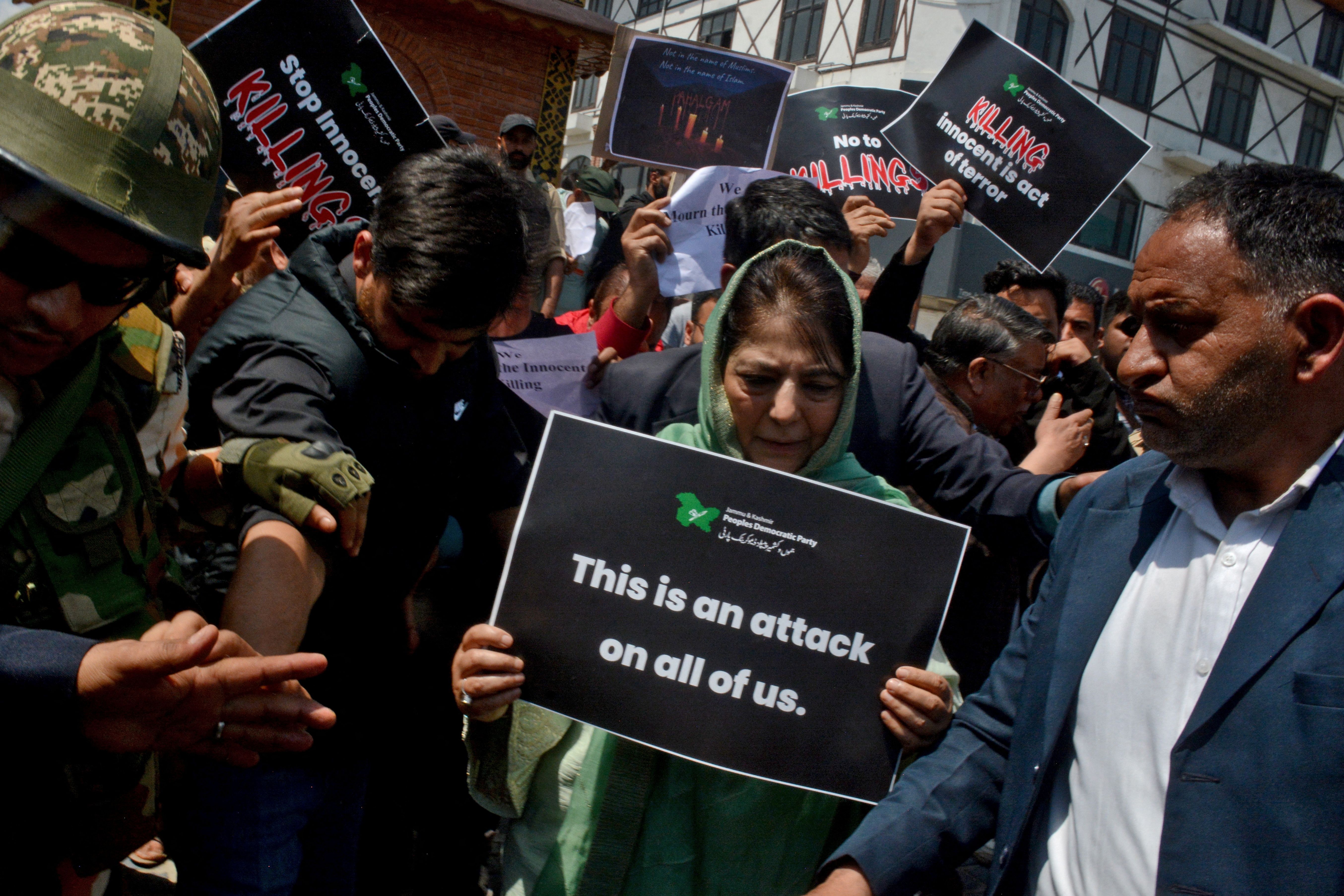 People protest after the attack in Kashmir. 