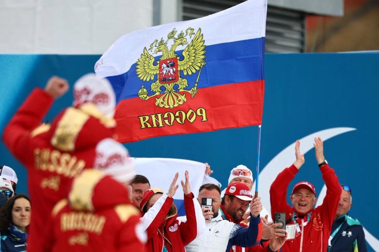 Fans with the flag of Russia are pictured ahead of the victory ceremony