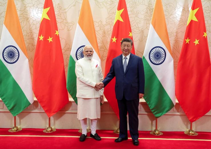 India’s Prime Minister Narendra Modi shakes hands with Chinese President Xi Jinping.