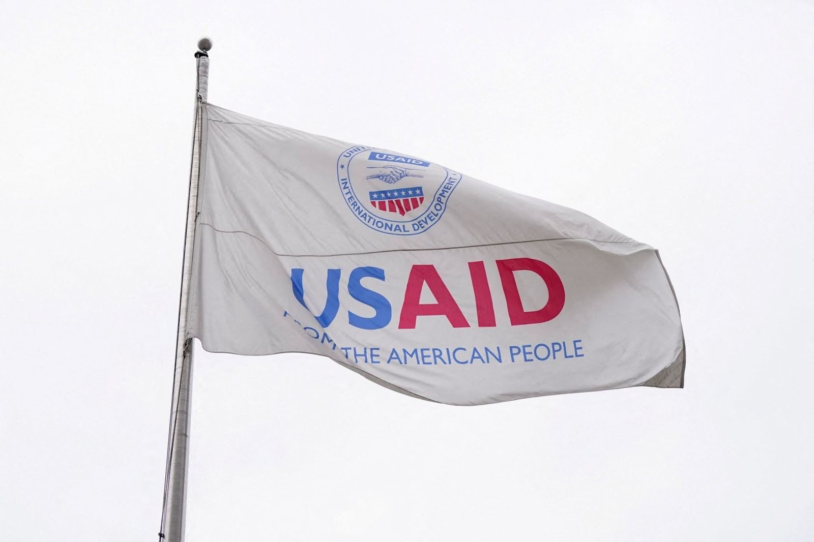 A USAID flag flutters outside the USAID building in Washington on Feb. 2025.