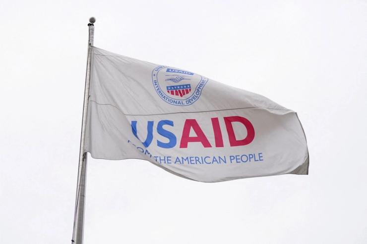 A USAID flag flutters outside the USAID building in Washington on Feb. 2025.