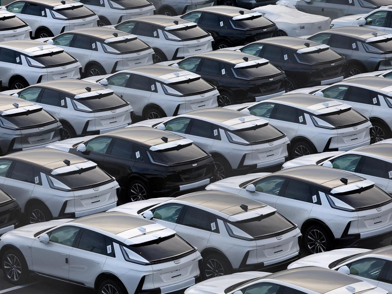 General Motors’ Cadillac vehicles are lined up at a vehicle storage yard at an industrial port in Yokohama.